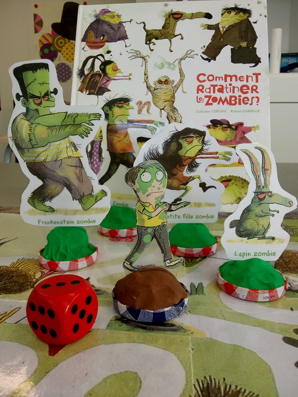 photo livre et son jeu de plateau comment ratatiner les Zombies